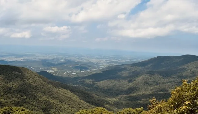 Blue Ridge foothills over rolling green countryside